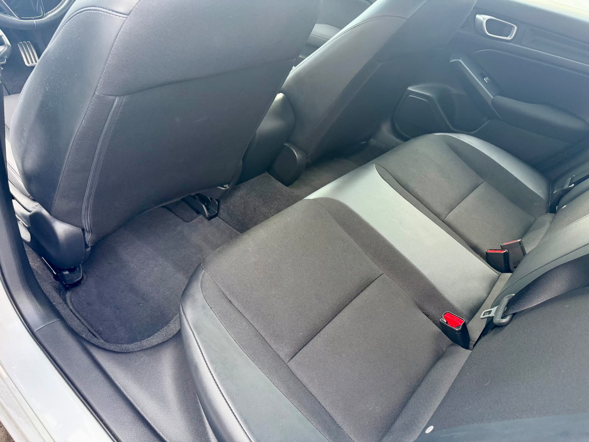 Rear seats and carpets before and after an interior detail